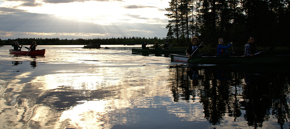 Canoeing on a calm Arctic lake in autumn