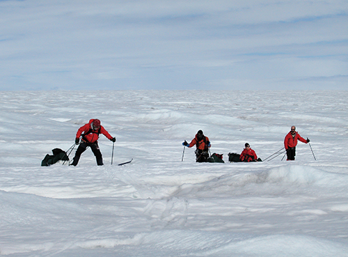 Climbers roped together moving onto the glacier