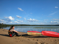 Kayaks on an Arctic lake shore in summer