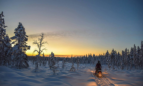 Snowmobile under the arctic sky near Hetta