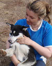 Anna with a husky at the farm